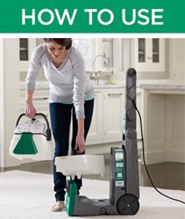 Woman using a Bissell Carpet Cleaner Rental
